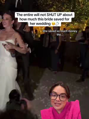 The image features a bride dancing during her wedding, captured from a somewhat low angle. The bride is wearing a white wedding dress. The creator is visible in a lower corner, wearing glasses and a bright pink top, interacting with the camera.
