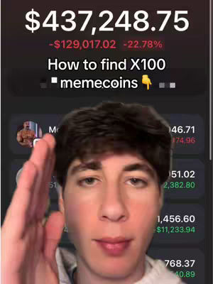 A selfie-style shot with a young man slightly angled towards the camera, arm raised, and hand extended towards the right. The background is a digital display showing financial data with elements like a dollar figure, percentages, and a list of numbers, against a dark background. The man is wearing a white or light-colored top.