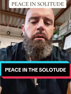 A bald man with a long beard is the primary focus. The upper portion of the image features text that reads 'PEACE IN SOLITUDE' in a white, sans-serif font. Below the man, a black rectangular overlay with text 'PEACE IN THE SOLOTUDE' is visible. A silver cross necklace is visible.