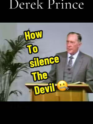 The image shows a man standing at a podium. Text overlays state: "Derek Prince" and "How to silence The Devil".  The text overlays are in the upper left and middle left respectively. The man is in a suit, and  a smiley face with a zipper on its mouth is at the bottom right .
