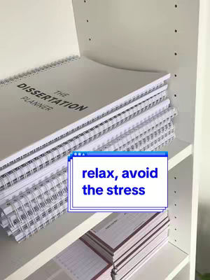 A photo shows a white shelf with a stack of white spiral-bound planners. The top planner reads "THE DISSERTATION PLANNER" in a simple, sans-serif font. In the foreground, a blue-framed element on the cover image declares, "relax, avoid the stress."