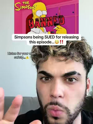 The cover image features a man in the foreground with a Simpsons image overlayed above him. The Simpsons image shows Homer Simpson with the word "BANNED" on it, with animated text underneath. Text overlays are present at the top and the bottom of the image.