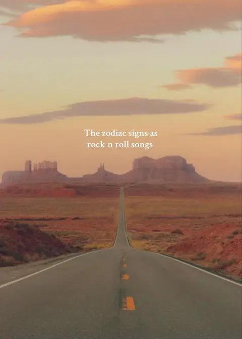 The cover image features a long, straight road receding into the distance towards a horizon with a desert landscape under a sunset sky. The sky gradients from orange to yellow to blue, suggesting dusk. The road is the central focus, guiding the viewer's eye. The foreground shows the road's surface with painted yellow lines. The background has rock formations. Text in a simple white font reads, 'The zodiac signs as rock n roll songs.'