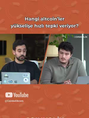 Two men are seated, facing forward with laptops in front of them, in what appears to be a studio setting. Text on the top describes the video topic. The YouTube logo and channel information are at the bottom.
