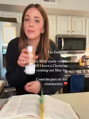 A woman in a kitchen setting holding a bottle in her right hand and an open book in front of her. Text overlays are present, and the overall composition is well-lit and casual.