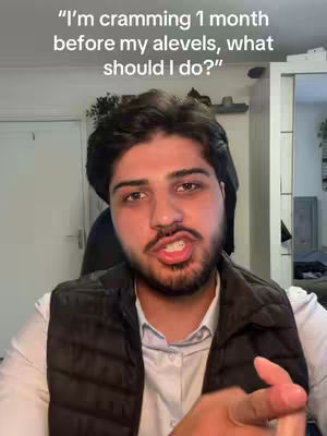 A selfie-style video with a man in a black vest talking directly to the camera. The background is a blurred room with white wall, door and a mirrored closet. Text overlay at the top indicates the video's topic concerning exam in a conversational voice.