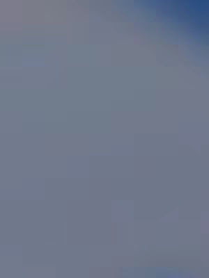 Image is a vertical gradient, starting dark gray at the top and subtly transitioning to light gray towards the bottom. The colors are muted, creating a calm and simple visual.