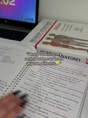 A desk setup with a laptop, an open notebook with handwritten notes, and a textbook titled 'Human Anatomy Atlas'. The text overlay reads a student's thoughs to their study process.