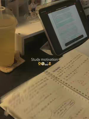 The cover image shows a study setup featuring a notebook, a tablet, a glass of yellow beverage, and some study supplies, with a warm-toned aesthetic.