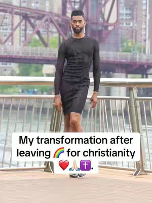A man in a black outfit stands on a wooden walkway with a metallic railing, a bridge is visible in the background. A text overlay in a white rectangular box reads, 'My transformation after leaving [rainbow emoji] for Christianity' with additional emojis, including prayer hands,  a heart, and a church symbol.