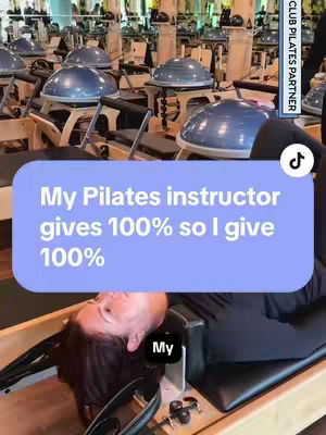 The image shows a woman lying on a pilates reformer machine, her head and shoulders visible. She's in a pilates studio with many machines in the background. Overlayed on top is a text box with the message, "My Pilates instructor gives 100% so I give 100%."