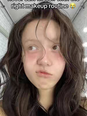 The cover image is a selfie featuring a young person with long wavy brown hair. The person is looking to the side with a somewhat distressed or questioning expression. The skin appears to have a slight blush on the cheeks. There is an overlay of text at the top.