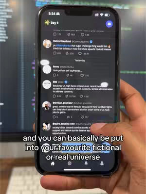 A close-up of a smartphone screen displaying a social media feed. Text appears overlaid on the image. The background is a blurred monitor and a hand holding the phone.