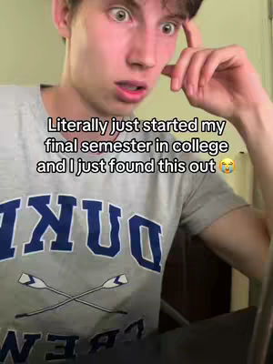 A young man with surprised expression on his face, hand touching his head. Text overlayed reads: "Literally just started my final semester in college and I just found this out". The man is wearing a grey t-shirt with a college logo on it. .