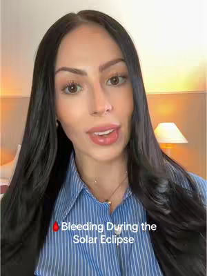 The cover image features a woman with dark hair and a blue and white striped shirt. The woman is looking at the camera and has a text overlay that says 'Bleeding During the Solar Eclipse'. The background is an indoor setting, with warm lighting.