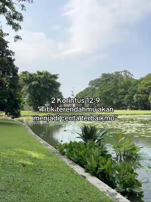 A serene outdoor scene. A body of water is in the foreground, surrounded by lush greenery and grass. In the center, text overlays appear, providing a message of hope. Behind, trees and a bright sky complete the picture.