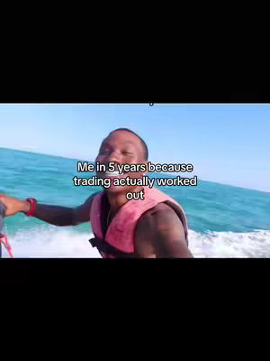 A man wearing a life vest is shown riding on a jet ski with ocean and a bright blue sky in the background. Text overlayed says, 'Me in 5 years because trading actually worked out'.