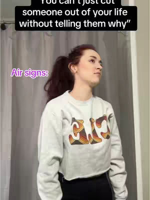 A woman in a light-colored sweatshirt is seen from the chest up, looking up with a thoughtful expression. Above her, a text overlay states, “You can’t just cut someone out of your life without telling them why.” To the left, a purple label reads "Air signs:". The background is a light-colored curtain, and the overall composition is simple.