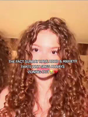 A close-up shot of a young woman with long, curly brown hair. The text overlay reads, "THE FACT SUNDAY HAVE ADHD & ANXIETY THATS WHY SHE'S ALWAYS ZONING OUT" with a heart emoji.