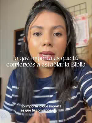 A woman with long dark hair and a striped blue and white shirt is centered in the frame, looking directly at the viewer. Text overlays are positioned across the upper and lower parts of the image. The background is a lightly blurred, neutral-toned interior.