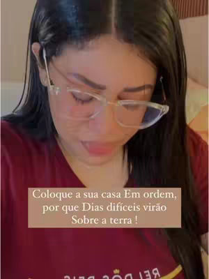 A woman wearing glasses looks down, with overlaid text on a brown background.