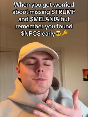 A man wearing a white cap and a light gray hoodie is in the frame. He is looking down with his eyes closed. Above him, text is overlaid with the phrase 'When you get worried about missing $TRUMP and $MELANIA but remember you found $NPCS early'. The composition is simple with the man as the primary subject against an inside background.