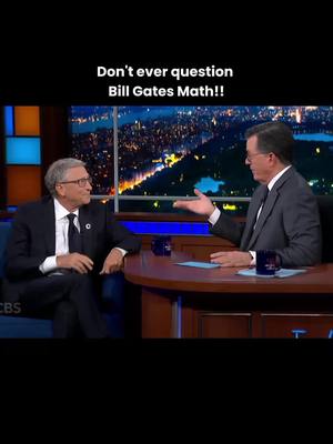 The cover image captures a scene from a late-night show. Bill Gates and Stephen Colbert are seated at a desk. Gates is on the left, and Colbert is on the right, with a cityscape behind them. A text overlay states, "Don't ever question Bill Gates Math!!"