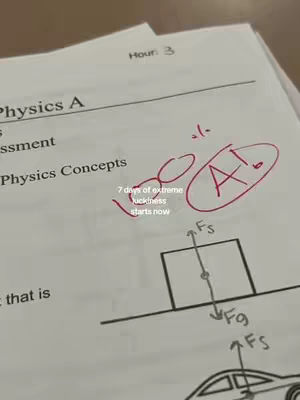 A close-up shot of a physics test paper with an 'A!' grade circled in red. Additional diagrams and text are visible, indicating a focus on physics concepts.