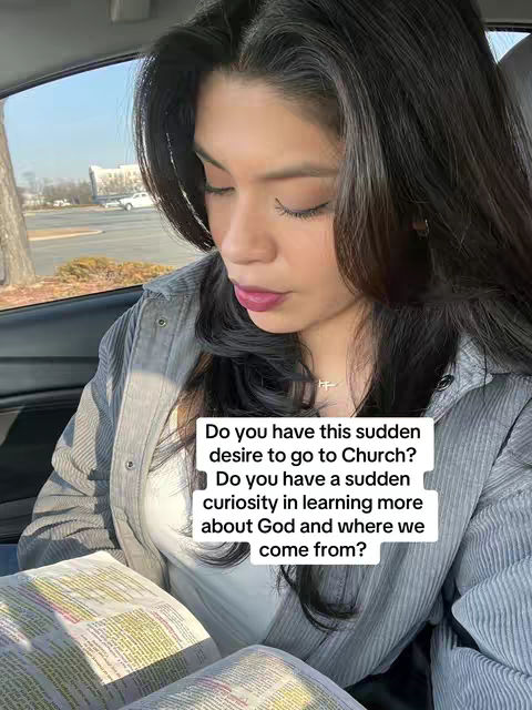 A woman with dark hair, wearing a gray collared jacket and a white top, is sitting in a car reading a book. The background shows a bright outdoor setting with a building and some trees visible through the car window. Overlayed on the image is a white text box with questions about faith and the desire to go to church.
