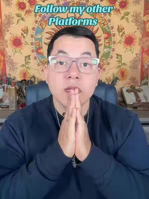 A medium shot shows a man with glasses in a navy blue sweater, hands clasped in prayer under his chin. Behind him is a tapestry with floral and zodiac motifs, and the text 'Follow my other Platforms' is superimposed at the top.