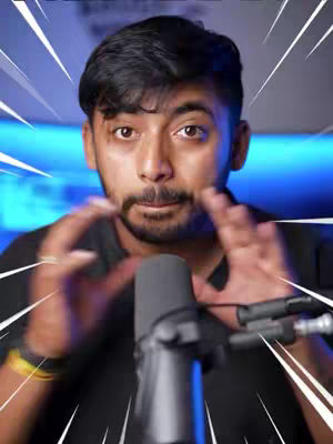 The cover image features a man in a close-up shot, with his hands up in a gesture, a microphone in front, and a blue background, with white radiating lines suggesting energy. The man is looking at the camera.