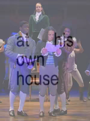 The image is a promotional shot for the musical 'Hamilton', set on a stage. Several costumed actors are in the foreground, with text overlays. The composition has a theatrical ambiance.