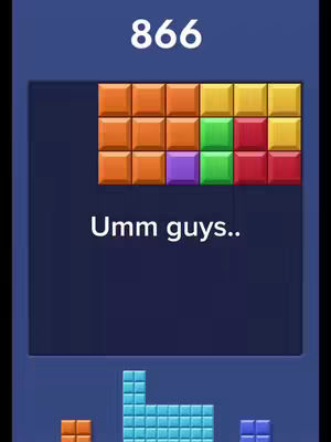 A mobile game screen displaying a game board filled with colorful blocks of different shapes, the game board floats within a dark blue background. At the top of the screen displays the score and in the bottom sections shows the current blocks available for the player to use.