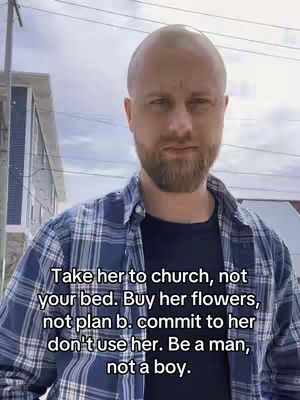 A man with a shaved head and a beard is the focal point, dressed in a plaid shirt over a black t-shirt. Text overlay in white font presents a message about relationships and values, visible against a backdrop of blurred buildings and a partly cloudy sky. The composition centers the man, using colors of blue, gray and natural skin tones.