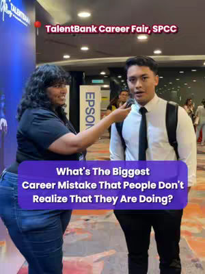 A slightly high-angle shot captures two individuals at a career fair. A woman with curly black hair, wearing a black t-shirt and jeans, holds a microphone towards a man in a white shirt and black tie, and black pants. Overlaid on the image are text boxes containing the video's main question.