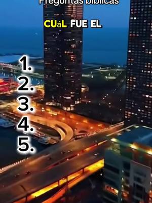 An aerial, nighttime shot of a city skyline with a tall skyscraper prominently featured. Numerals and text overlays are added to the image for a quiz format.