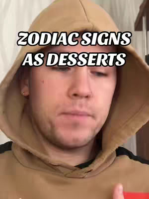 A close-up shot of a man wearing a tan hoodie, facing forward with text overlayed on the image.