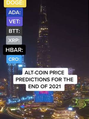 An aerial view of a city at night, dominated by a towering skyscraper illuminated in blue, red, and white lights. A series of colored boxes, each labeled with cryptocurrency abbreviations (DOGE, ADA, VET, BTT, XRP, HBAR, CRO), are arranged to the left side of the frame. A white rectangular text box at the bottom contains the phrase "ALT-COIN PRICE PREDICTIONS FOR THE END OF 2021". The scene is set against a dark sky, suggesting a nighttime setting.