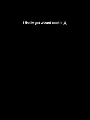 Black screen with white text overlayed that reads: I finally got wizard cookie. accompanied with a praying hands emoji