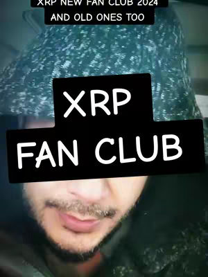 A selfie-style video cover image showing a person with a short beard. A black rectangle with white text overlays the person's face that reads "XRP FAN CLUB". Above the text is a second black rectangle with white text: "XRP NEW FAN CLUB 2024 AND OLD ONES TOO". The background fades into a slightly blurred green and white textured pattern.