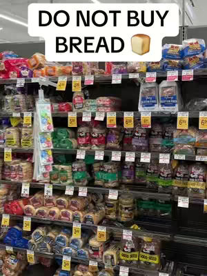 The image shows a well-stocked grocery store shelf filled with various types of packaged bread. Above the shelf, a large white rectangular banner reads: "DO NOT BUY BREAD", with a cartoonish image of a bread loaf to the right. The bread packages are neatly arranged and labeled with colored tags.