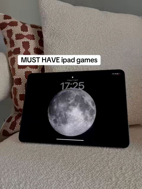 The cover image shows an iPad propped up on a soft, textured white surface, likely a couch or bed. A patterned pillow is partially visible on the left. The iPad displays the moon phase on the screen with the time 17:25.