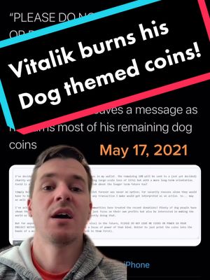 A man is in the foreground against a blurred background that looks like a phone screen showing text. Overlayed text in vibrant colors, along with date and the phrase "Vitalik burns his dog themed coins!"