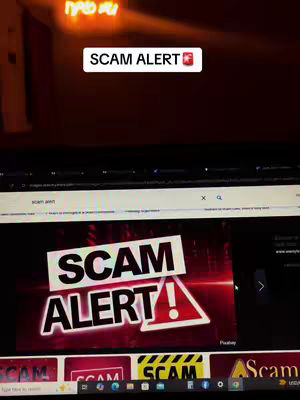 The image features a laptop screen displaying the search results for the text `scam alert`. The top portion of the image shows what seems to be a dimly lit room, with a glowing sign. The screen shows an image of the words `SCAM ALERT` and an exclamation point within a triangle. The text `Scam Alert` is also present on a white rectangle.