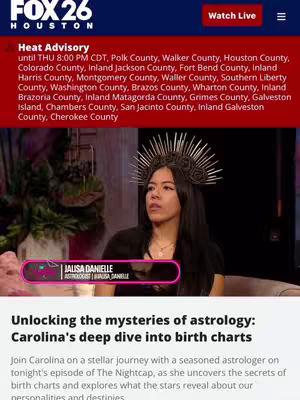 A woman with dark hair wearing an elaborate headpiece is centered in the image, facing the camera. She's set against a blurred background that appears to be a studio setting, with a news banner at the top. Below her, a text overlay identifies her as an astrologer.