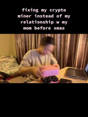 The cover image shows a person working on a crypto miner. Text overlay on the top states: "fixing my crypto miner instead of my relationship w my mom before xmas"