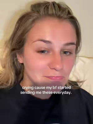 A close-up shot shows a young woman looking at the camera with a slightly sad expression. Text overlayed on the image reads, \"crying cause my bf started sending me these everyday.\" The style is casual, and the lighting appears to be soft and natural.