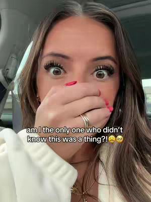A close-up shot of a woman expressing surprise. Her wide eyes and covered mouth create a sense of shock. Text overlays the image.