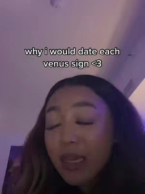 A selfie-style video cover. A young woman with long hair is centered, softly lit, with a text overlay. The text is set in a sans-serif font over the woman’s head. The background is dark, purplish, with the visible part of the wall.