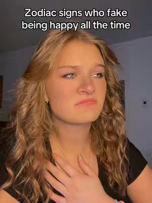 A young woman with long blonde hair is the central focus, looking sad and holding her hand over her heart. Text overlays the image.